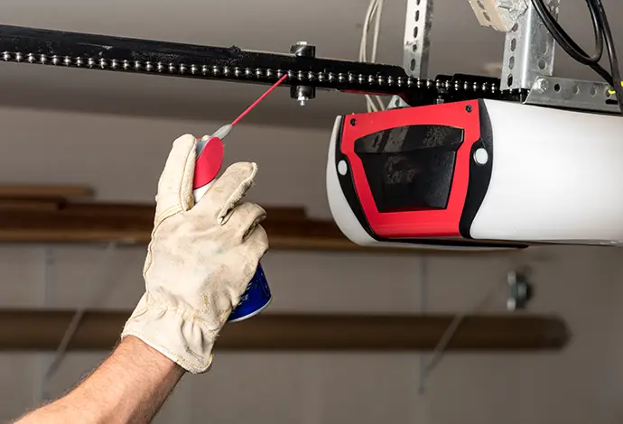 Applying oil to a chain of a garage door opener
