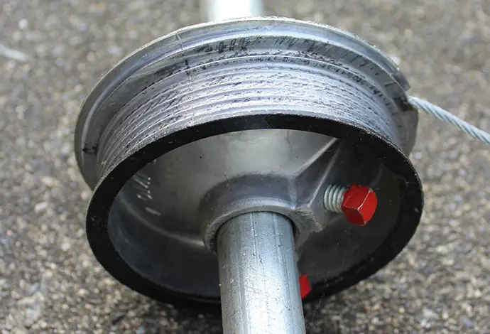 Garage door cable pulley wheel